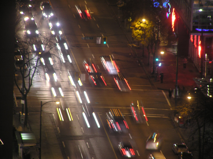 Photo of a city street at
                                          night with cars going both
                                          ways